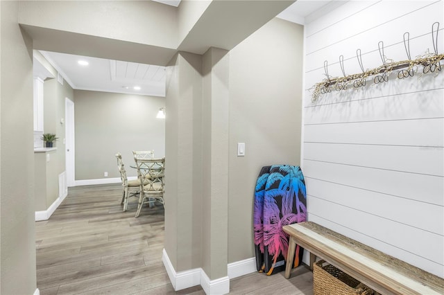 mudroom with light hardwood / wood-style flooring