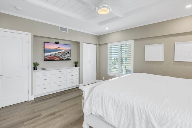 bedroom with light hardwood / wood-style flooring and ceiling fan