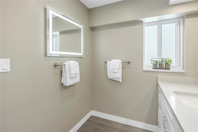 bathroom featuring hardwood / wood-style floors and vanity