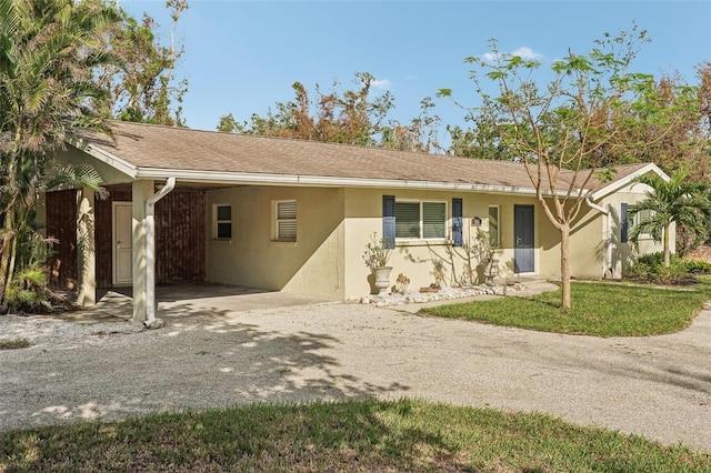 single story home with a carport