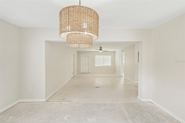 hallway featuring a notable chandelier