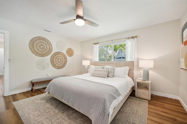 bedroom featuring wood-type flooring and ceiling fan