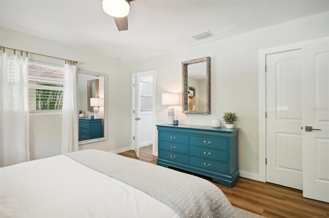 bedroom featuring ceiling fan and dark wood-type flooring