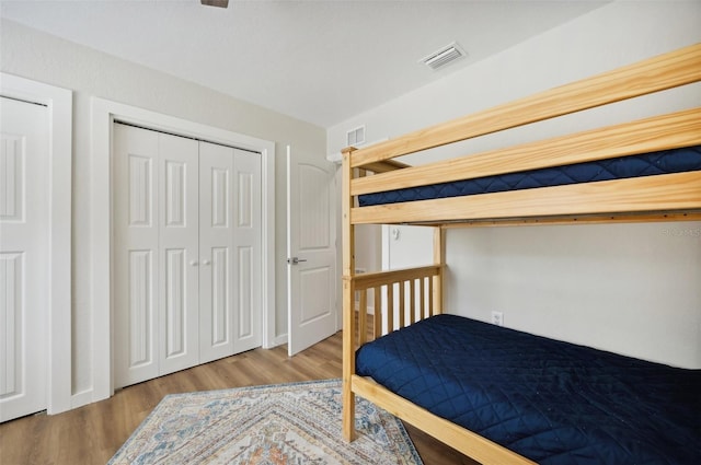 bedroom featuring light hardwood / wood-style flooring and a closet