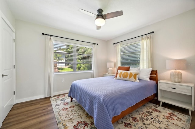 bedroom featuring ceiling fan and dark hardwood / wood-style flooring