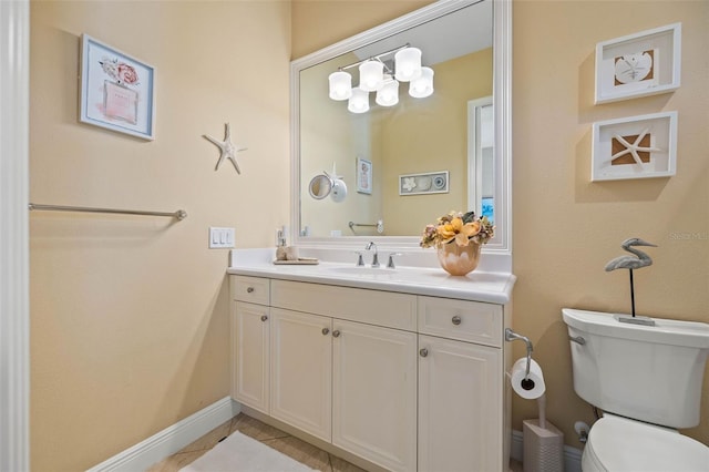 bathroom featuring vanity, toilet, and tile patterned floors