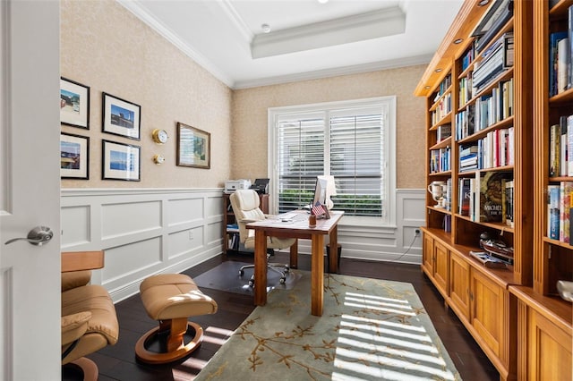 home office featuring ornamental molding, a tray ceiling, and dark wood-type flooring