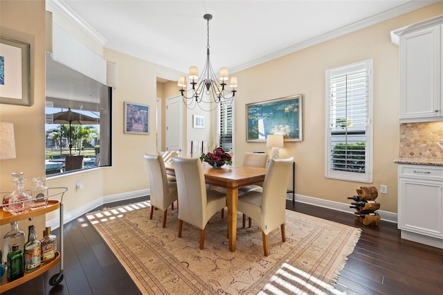 dining room featuring a notable chandelier, dark hardwood / wood-style floors, and crown molding