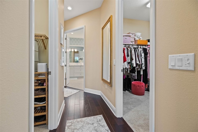 corridor with dark hardwood / wood-style floors