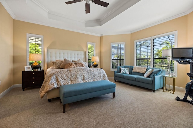 bedroom featuring ceiling fan, crown molding, and multiple windows