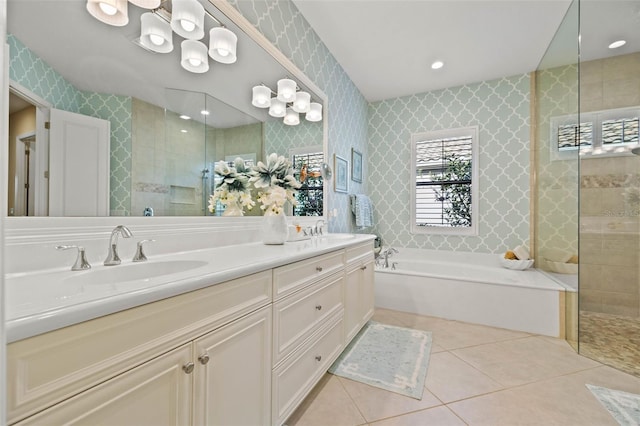 bathroom with tile patterned flooring, vanity, and plus walk in shower