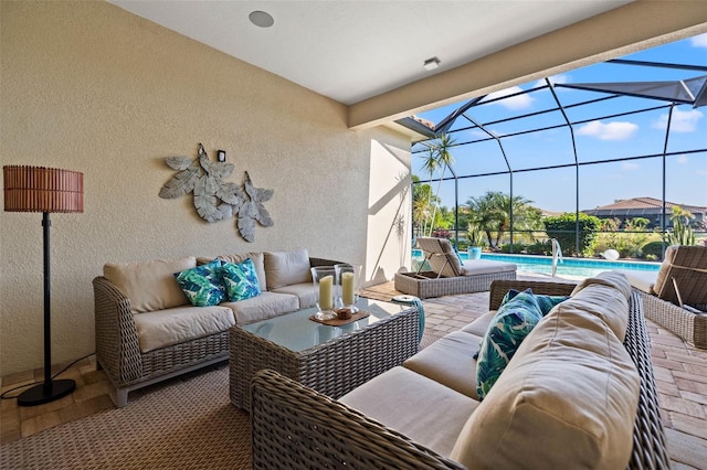 view of patio / terrace featuring outdoor lounge area and glass enclosure