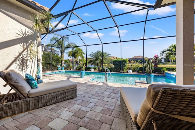 view of pool with a lanai and a patio area