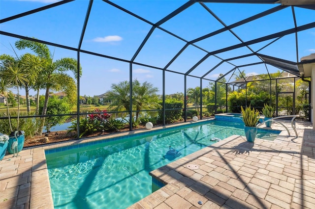 view of swimming pool featuring a lanai and a patio area