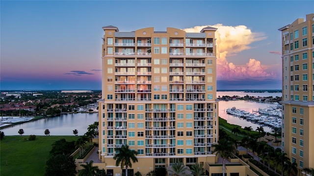 outdoor building at dusk featuring a water view