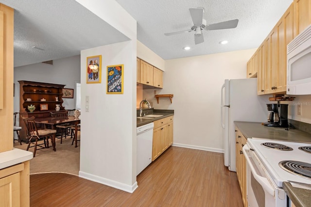 kitchen featuring light wood-type flooring, a ceiling fan, light brown cabinetry, a textured ceiling, and white appliances
