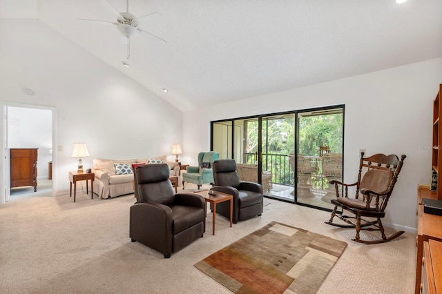 living room with light carpet, baseboards, high vaulted ceiling, and a ceiling fan