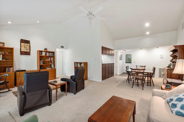 living room featuring high vaulted ceiling, recessed lighting, a ceiling fan, and light carpet