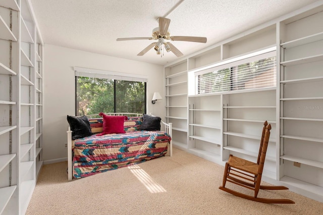 bedroom with a textured ceiling and ceiling fan