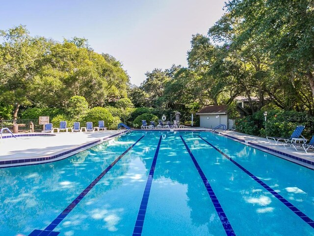 view of pool with an outdoor structure