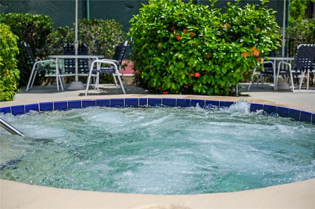 view of pool featuring a patio and a hot tub