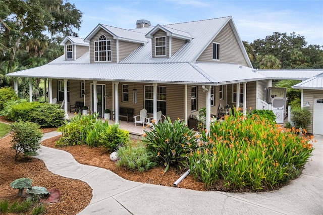 view of front of house with a porch and a garage