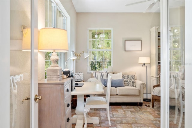 living area featuring ceiling fan