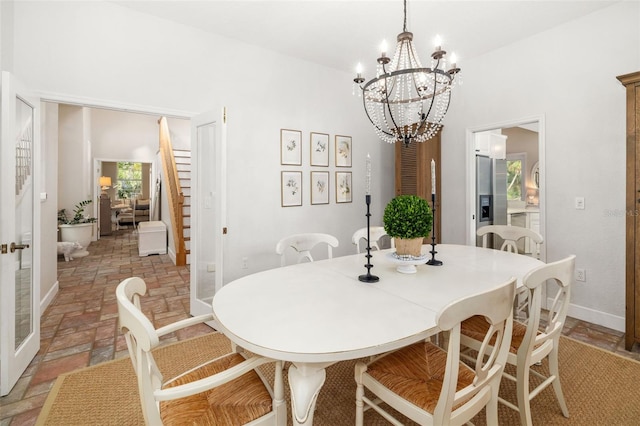 dining space with a notable chandelier