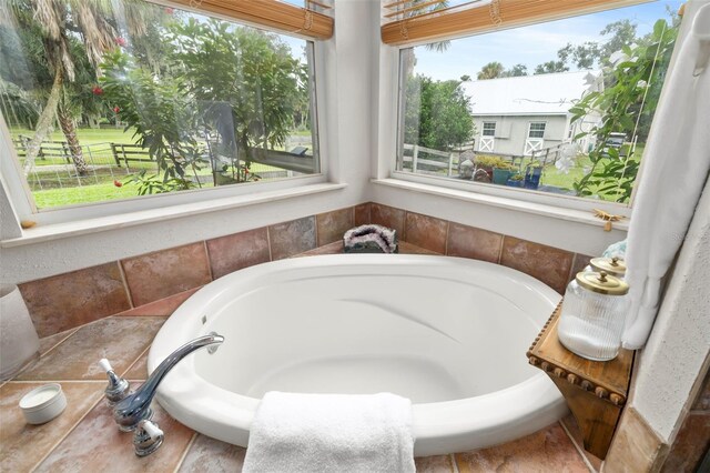 bathroom with tiled bath