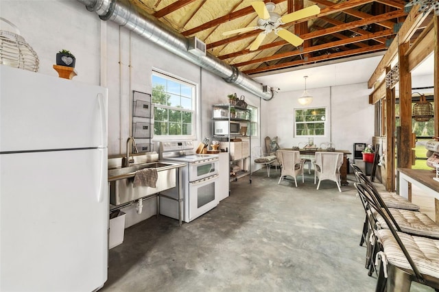 kitchen with sink, hanging light fixtures, white appliances, and ceiling fan