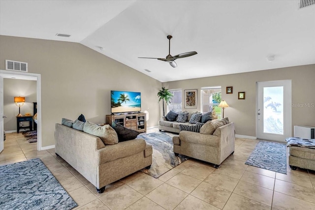 tiled living room with ceiling fan and lofted ceiling