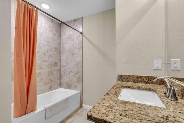 bathroom featuring vanity and shower / bath combination with curtain