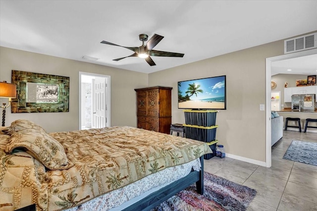 tiled bedroom with ceiling fan and stainless steel refrigerator with ice dispenser