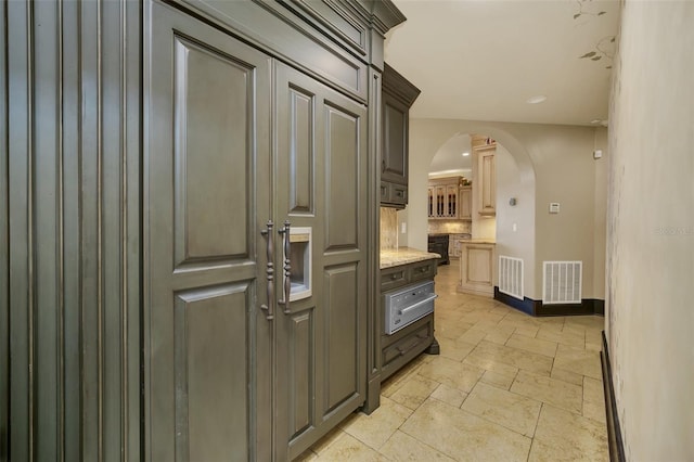 kitchen with light stone countertops