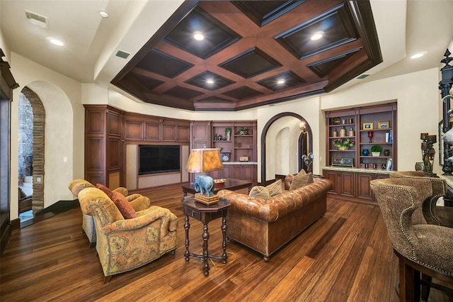 living room featuring beam ceiling, coffered ceiling, and dark wood-type flooring