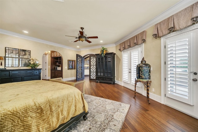 bedroom featuring crown molding, ceiling fan, and dark wood-type flooring