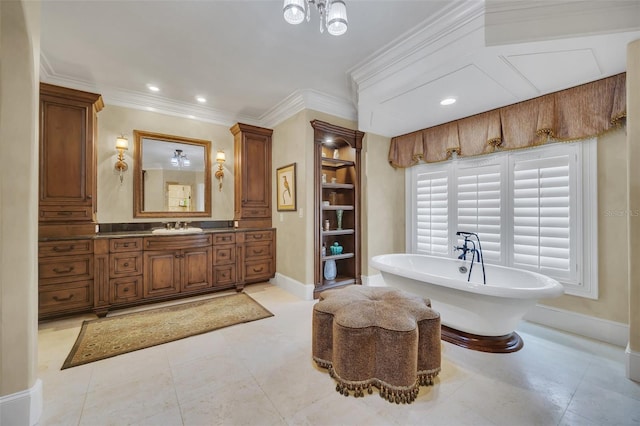 bathroom with vanity, crown molding, and a washtub