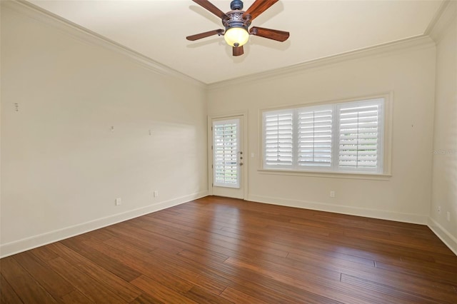 spare room with ceiling fan, ornamental molding, and dark wood-type flooring