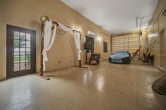 garage featuring an AC wall unit