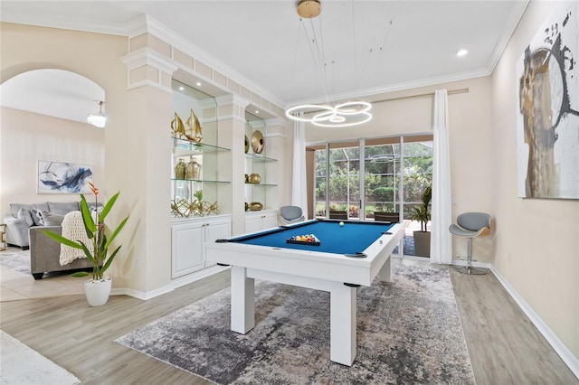 playroom with pool table, light hardwood / wood-style flooring, and crown molding