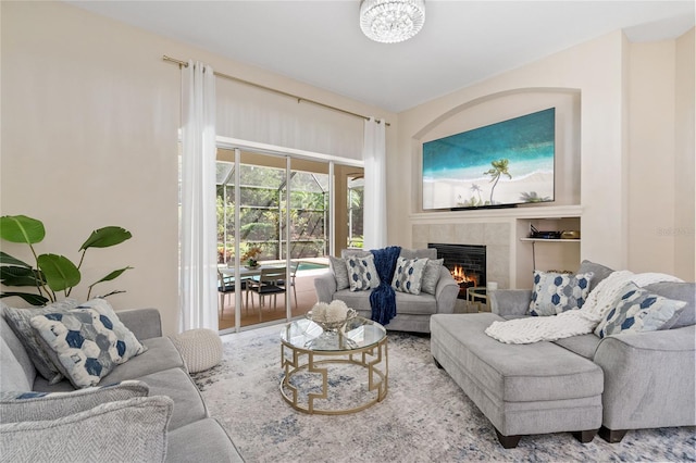 living room featuring a tile fireplace