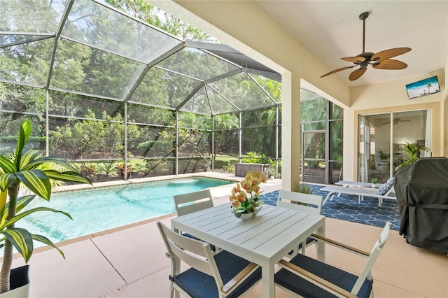 view of pool with a patio area, a lanai, and ceiling fan