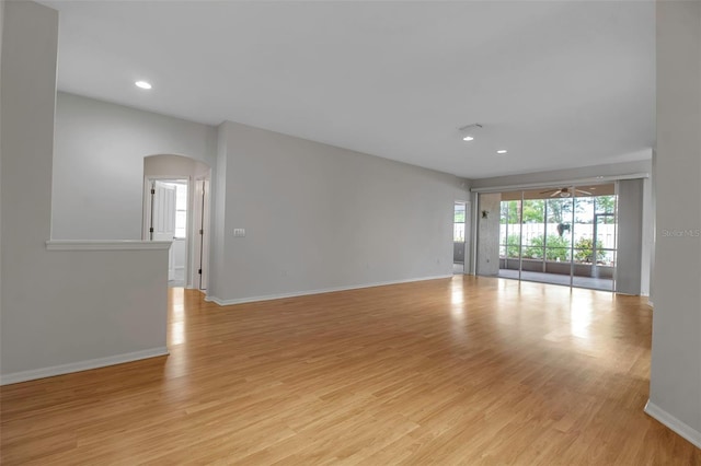 unfurnished room featuring ceiling fan and light wood-type flooring