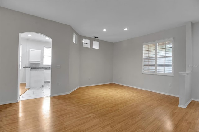 unfurnished room with light hardwood / wood-style floors