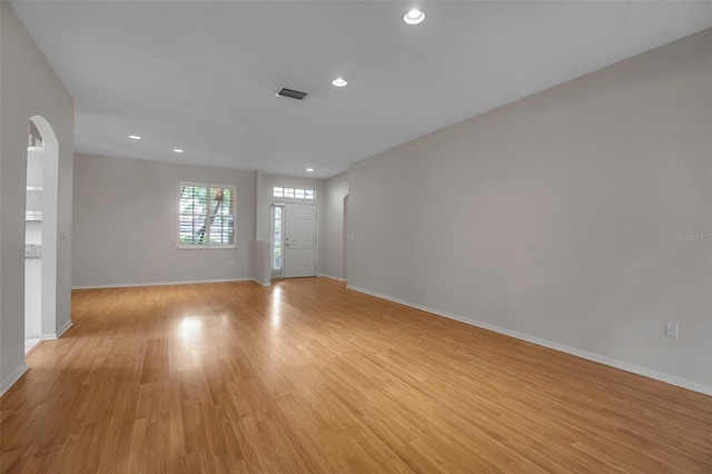 unfurnished room featuring light wood-type flooring