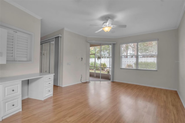 interior space featuring ceiling fan, crown molding, and light hardwood / wood-style floors