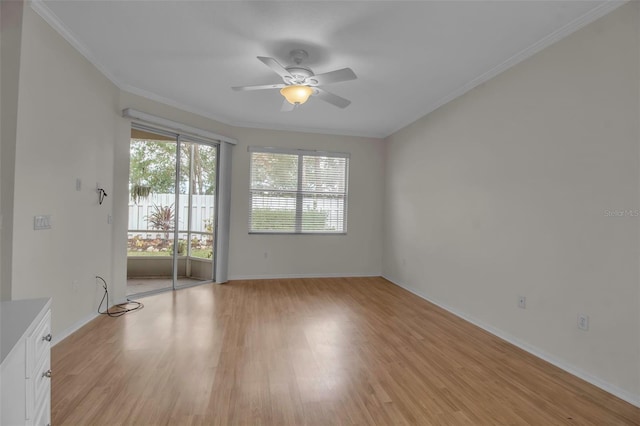 spare room featuring ceiling fan, light hardwood / wood-style floors, and ornamental molding