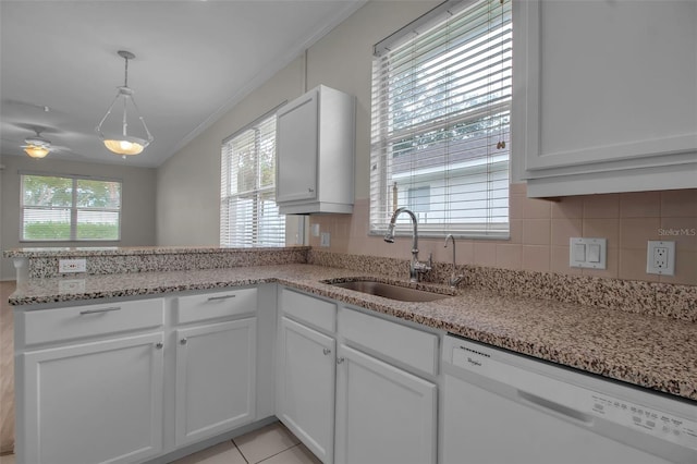 kitchen featuring white cabinets, ceiling fan, sink, and white dishwasher