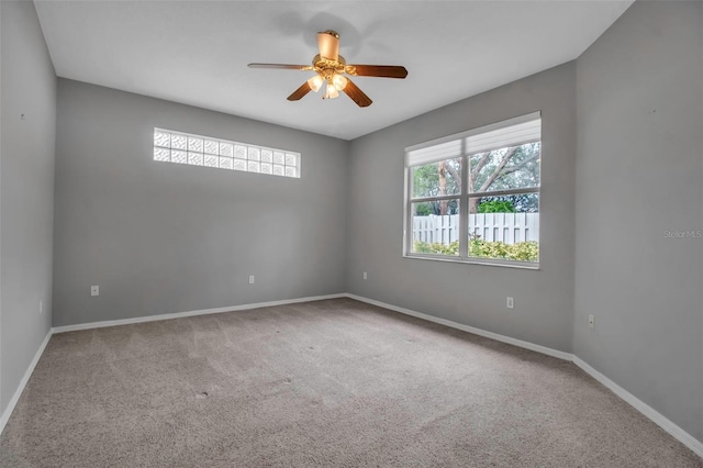 spare room with carpet and ceiling fan