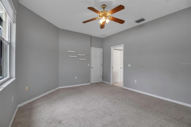 carpeted empty room with ceiling fan